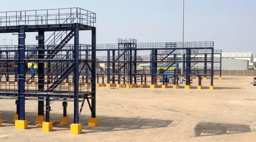 Elevated steel platform and staircase structure under construction on foundation blocks at the GPHA Reefer Terminal, Tema.