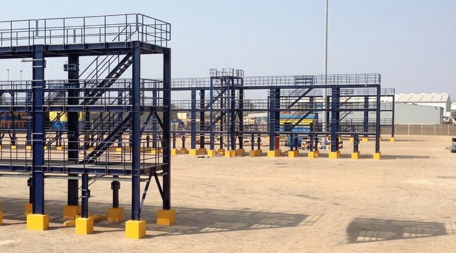 Elevated steel platform and staircase structure under construction on foundation blocks at the GPHA Reefer Terminal, Tema.